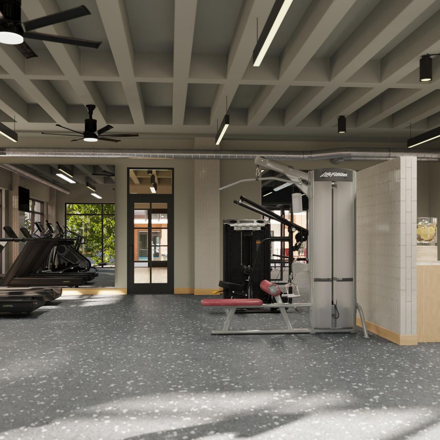 Sonder Interior of a gym showcasing several treadmills and diverse exercise equipment for fitness activities.