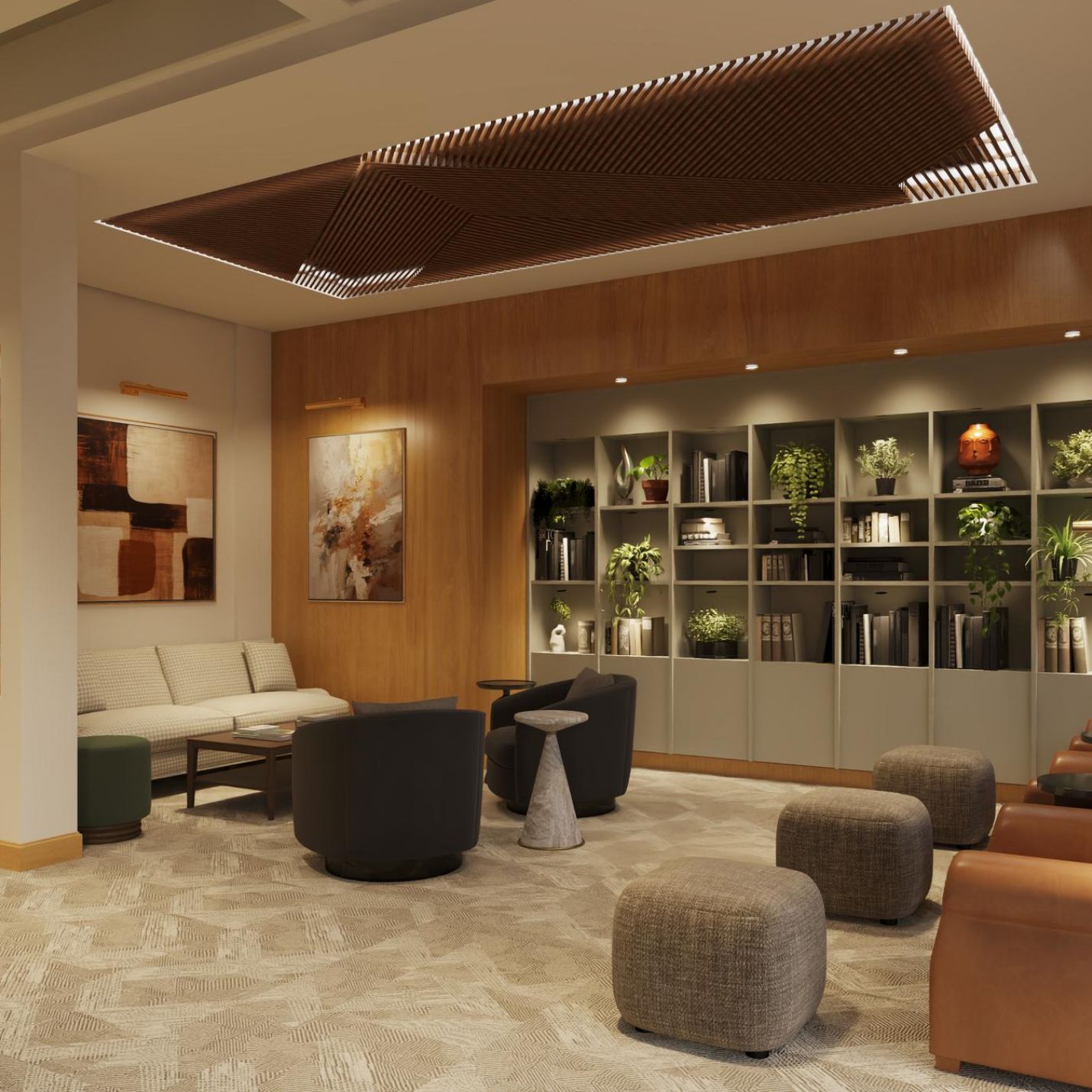 Sonder A lobby featuring a large bookcase filled with books and several comfortable chairs arranged for seating.